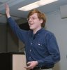 Photo of Alex raising his hand with the audience
