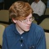 Photo of Alex talking with the audience before the speech starts