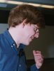 Photo of Alex talking to an audience member